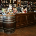 Commercial Custom Wine Cellars Custom Cash wrap with wine barrel tabletop