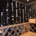 Metal Wine Racks and Custom Wine Racks Memphis Tennessee - wine room left wall with metal racks above and solid diamond bins and case storage below