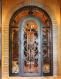 fort-worth-tuscan-wrapped-arch-grapes-wrought-iron-wine-cellar-door