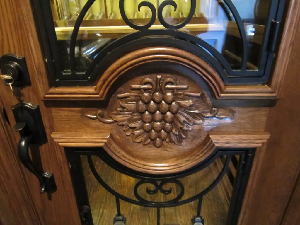 Custom Wine Cellar - McKinney Nr Dallas, Texas - Close up of hand carved grapevine design