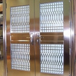 $4,495.00  304 Stainless  Double tempered glass  Design is in between glass for easy cleaning  Door is mounted to frame  Handle, lock & keys included  385 lbs  Rough Cut: 67.25” X 84.25”  Both Doors: 63” X 80.75”  Door swings out  5 year warranty