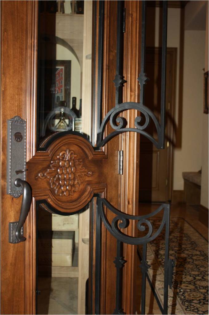 Texas wine cellar door_operable wrought iron