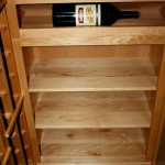 23 Horizontal magnum storage over 3 rows of solid case bins Teexas wine cellar display