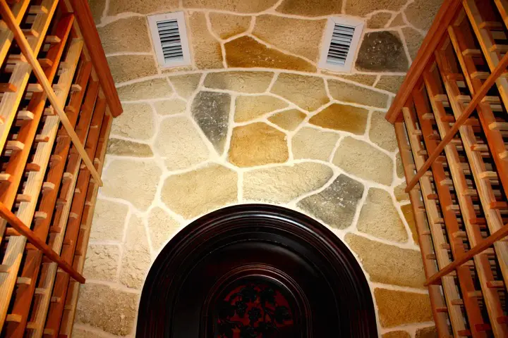 8. Custom Wine Cellar in Colleyville, Texas with Stone Walls and Ceiling
