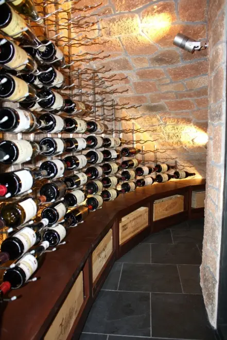 Case storage Below the Metal Wine Racks in a Home Wine Cellar