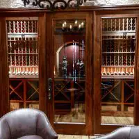 The room where most of the wine is stored in this Dallas-Fort Worth home is separated from the rest of the wine cellar with beautiful glass and wood doors. A custom space like this is quite the perk for potential buyers when you resell.