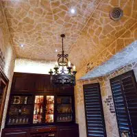 The chandelier is a central piece of this room, making the room appear more luxurious. Its the details, like this wine cellar, that really add value to a home.