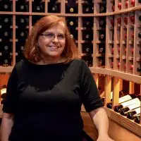 Nancy Higgins, owner of Wine Cellar specialists, inside this Dallas, Fort Worth custom wine cellar they helped build.