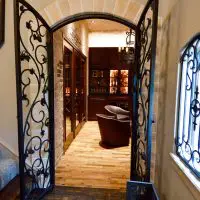 The entryway to the inside of this Dallas, Fort Worth custom wine cellar. This robust door definitely has character and elegance, and those attributes are valuable during resale.