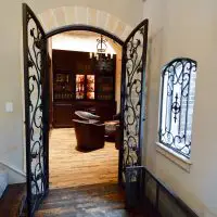 A different view of the wine cellar\'s door in this Dallas- Fort Worth home.