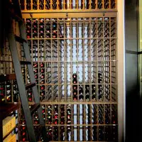Custom wooden wine racks for a Massive wine cellar. Floor to celing wine storage for a huge collection of wine.