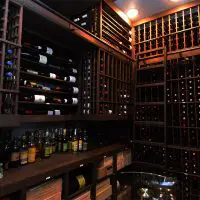 The massive storage of the wine room necessitated a ladder to reach the wines closer to the ceiling. The wine room can hold over 3000 bottles of wine.