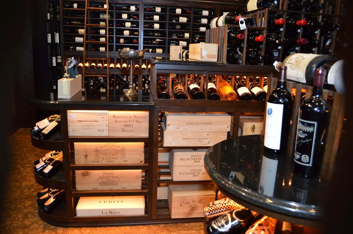 Wooden Case Bins for Bulk Storage: a Custom Feature in this Home Wine Cellar Installed in Florida