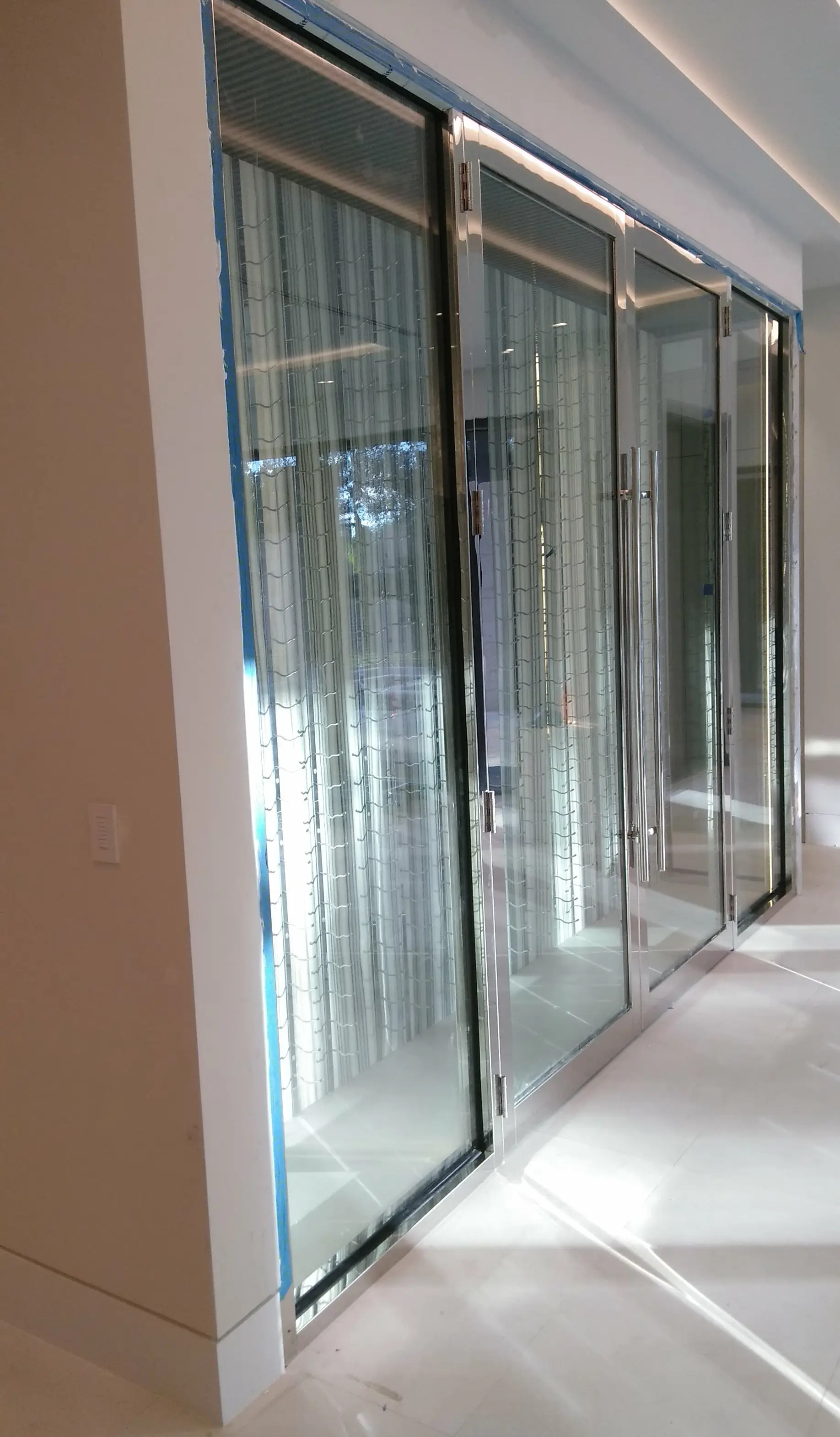 Custom Stainless Steel Wine Cellar Door Designed by Texas Experts