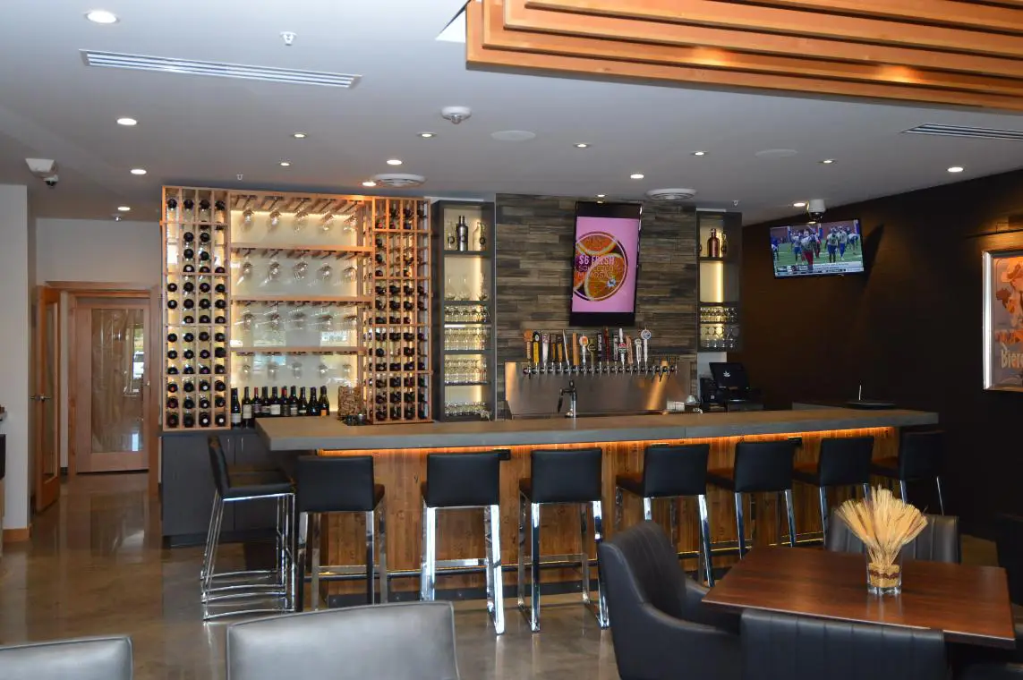 The Wine Bar That Separates the Custom Commercial Wine Cellar Built in Fort Worth, Texas