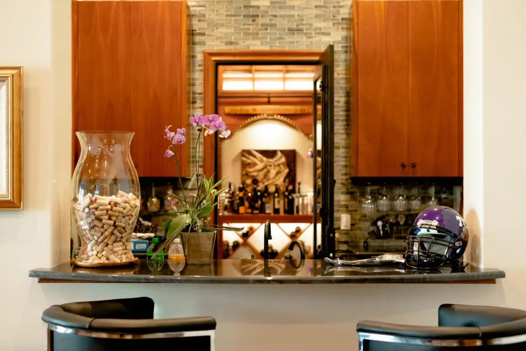 Transitional Wine Cellar and Bar Area in North Dallas