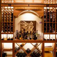 This custom tasting nook adds a personal touch to this residential wine cellar.