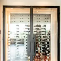 A front view of the glass wine closet in a high rise condo.