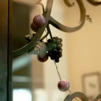 A closer view of Glass Door with Iron Inlay Design.