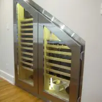 This is a beautiful way to add wine storage under the stairs in your home.