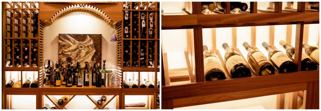 centerpiece of bar area and wine racks in transitional wine cellar design in dallas