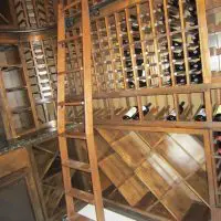 New Orleans wine cellar bent ladder allows usage over double deep end section