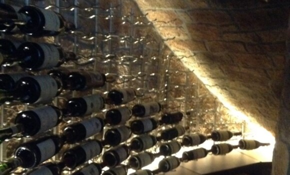 Ribbon lighting behind the case storage shines up through the VintageView racking from below