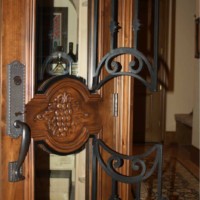 Texas wine cellar door_operable wrought iron