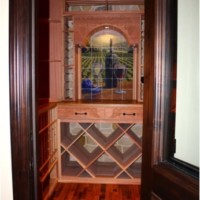 38. Doorway of Wine Room Showing Wine Barrel Flooring and Wood Racking