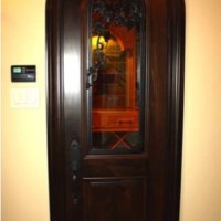 4. Custom Grapevine Carved Door in Colleyville, Texas Wine Room