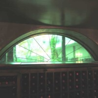 Stained Glass Double Pane Window with Sunburst Design and Green Antique Glass New Orleans Wine Cellar