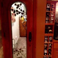 2 - Wine Cellar Door - with duel pane glass, automatic door bottom and wrought iron grapevine design