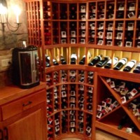 8 - Curved Wine Rack Corner with Lighted Display Row in Illinois Wine Room