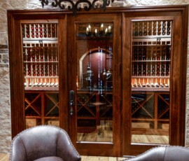 The room where most of the wine is stored in this Dallas-Fort Worth home is separated from the rest of the wine cellar with beautiful glass and wood doors. A custom space like this is quite the perk for potential buyers when you resell.
