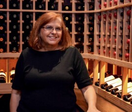 Nancy Higgins, owner of Wine Cellar specialists, inside this Dallas, Fort Worth custom wine cellar they helped build.