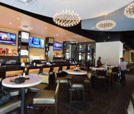 A custom commercial wine cellar Adds to the luxurious ambiance at Jasper's Restaurant at Citylinein Richardson, Texas.