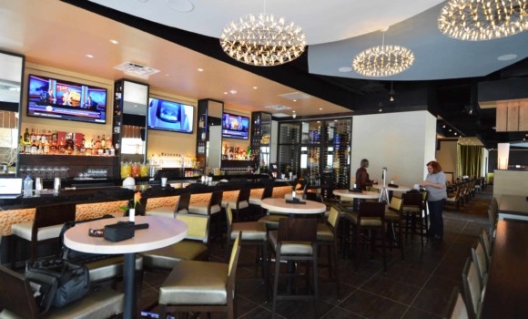 A custom commercial wine cellar Adds to the luxurious ambiance at Jasper's Restaurant at Citylinein Richardson, Texas.