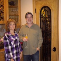 16 The Danns in Front of their New Home Wine Cellar