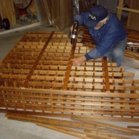 21 Wine Rack Assembly in the Garage Screwing the Back Stabilizers