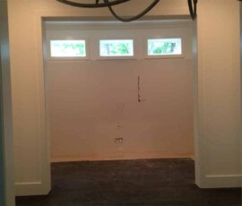 Before the custom wine cellar was installed, the room was just a blank space in the home.