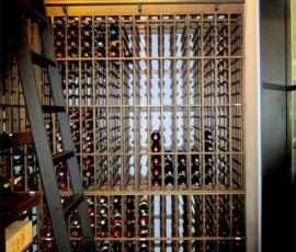 Custom wooden wine racks for a Massive wine cellar. Floor to celing wine storage for a huge collection of wine.