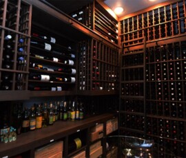 The massive storage of the wine room necessitated a ladder to reach the wines closer to the ceiling. The wine room can hold over 3000 bottles of wine.