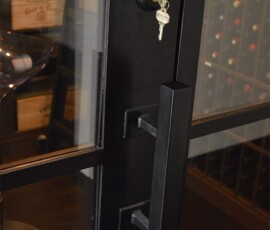 The wine cellar is locked behind a custom iron door, which can only be opened with a key.