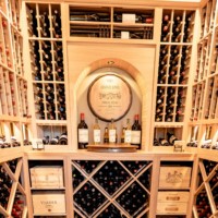 Center view of the arch design with the wine racks in different styles.
