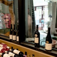 Wine bottles scattered as part of display style.