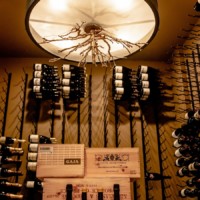 Beautiful arrangement of wine rack with the decor in the ceiling.