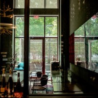 A view from the commercial wine room to outside.