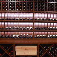 The walls behind  the wine rack (which you don't see) is also covered in Sapele Mahogany .