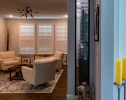 A solid, insulated wall separates this transitional wine closet from the kitchen.