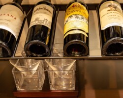 We also added a small stemware rack beneath the display row so the owners can conveniently enjoy a drink.